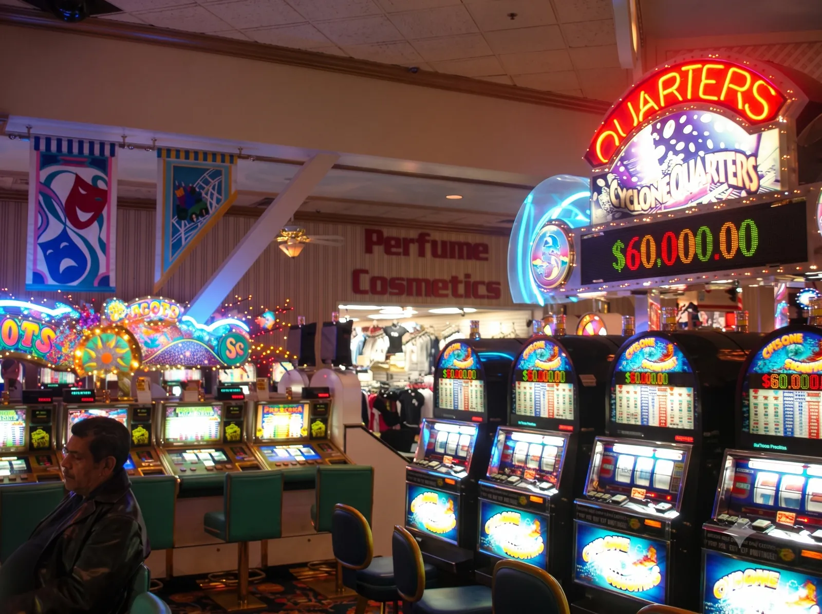 Cyclone Quarters slot machines glowing beneath a sixty-thousand-dollar progressive sign on the Boardwalk casino floor in 2006.