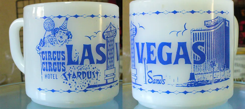 Vintage milk-glass souvenir mugs printed with Circus Circus, Stardust and Sands artwork.