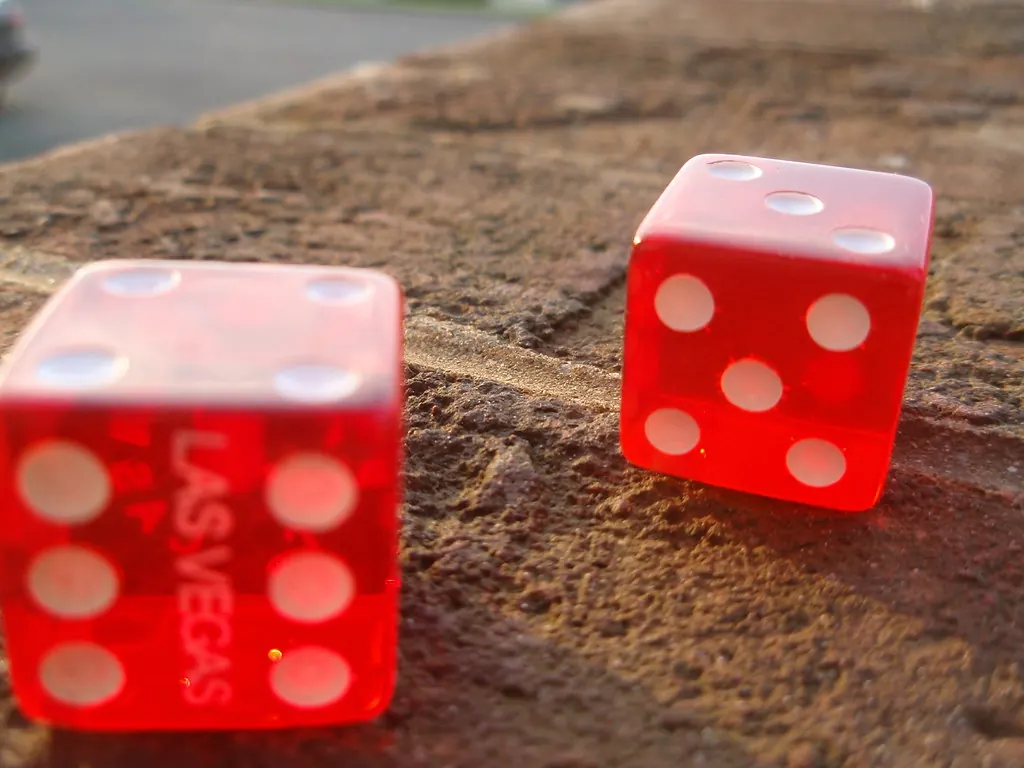 Pair of small red souvenir dice printed with Las Vegas.