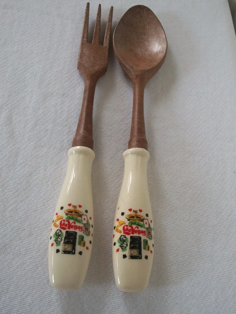 Vintage Las Vegas souvenir wooden salad fork and spoon with illustrated handles.