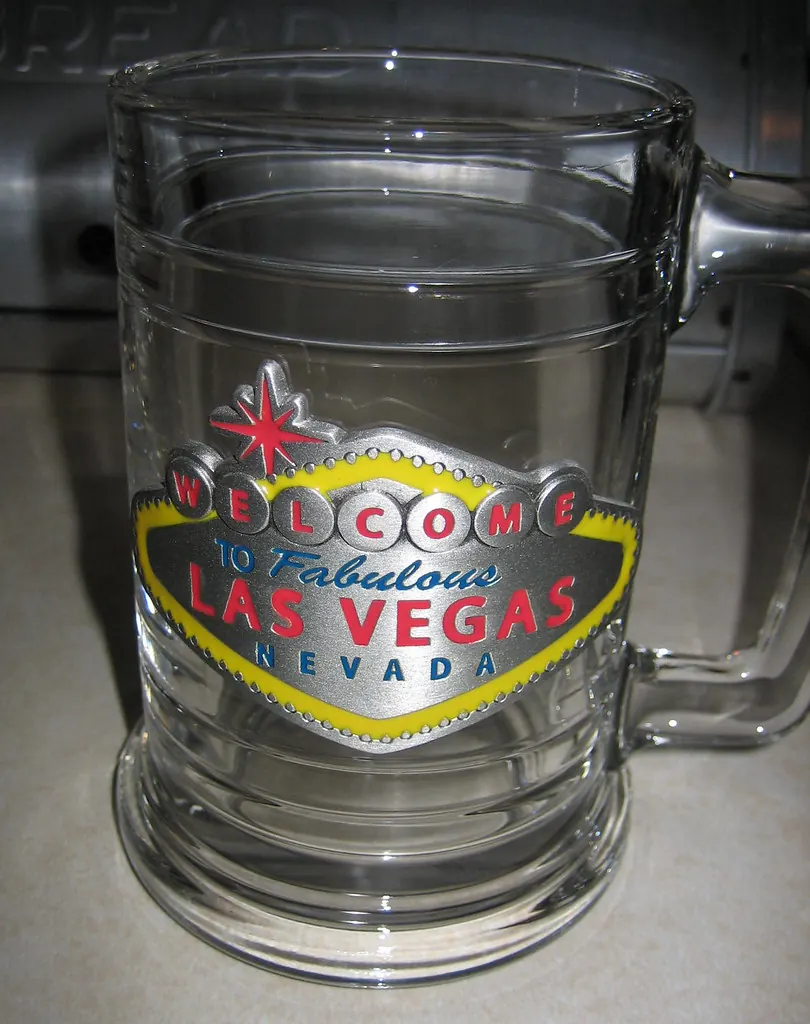 Clear souvenir mug decorated with the Welcome to Fabulous Las Vegas Nevada sign.